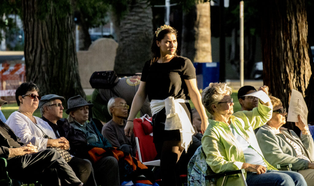 Actor walking through the audience outside